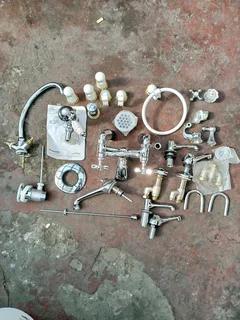 Britannia shower mixer, Victoria style bath taps and various other taps and parts. New