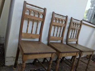 oak dining table with three chairs