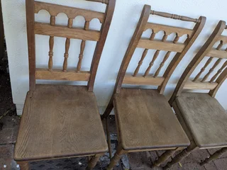 oak dining table with three chairs