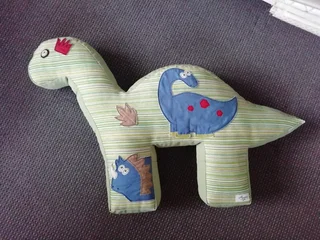 A nursing pillow and nappy stacker