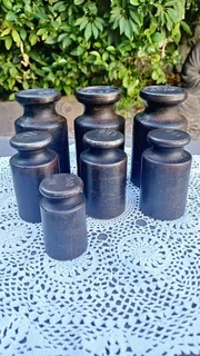 7 vintage cast iron cylinder-shape scale weights