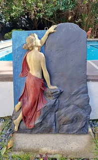Vintage sculpture - Oread (mountain nymph) ascending rock face