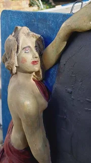 Vintage sculpture - Oread (mountain nymph) ascending rock face