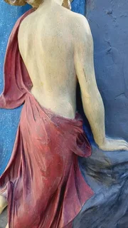 Vintage sculpture - Oread (mountain nymph) ascending rock face