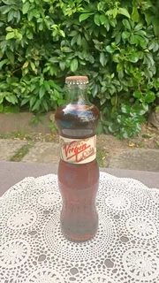 Richard Branson’s Virgin Cola.  “Voluptuous” glass bottle  “The Pammy”. Sealed with original content