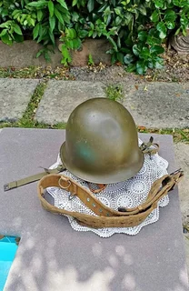 Vintage SADF CJ Fuchs Ltd (1966) "Staaldak" helmet with inner doily + web belt.
