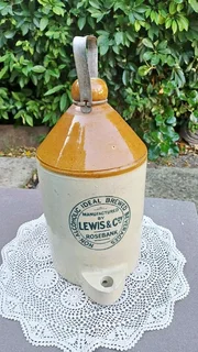 Stoneware flagon with handle. “Non-Alcoholic Ideal Brewed Beverages”. Lewis & Coy