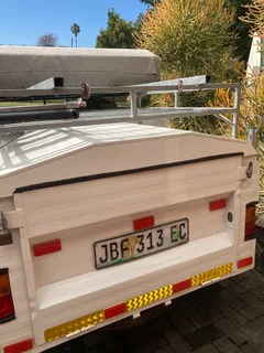 Trailer with rooftop tent