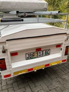 Trailer with rooftop tent