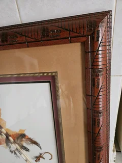 Very rare artwork using actual Pocurpine spines framed in heavy and decorated wood set in 3D