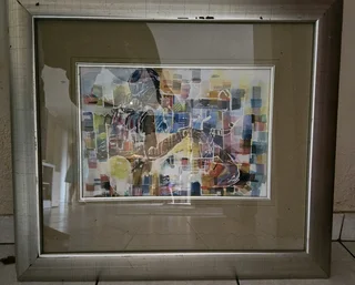 Beautiful African art print set in a heavy wooden frame in colored Silver