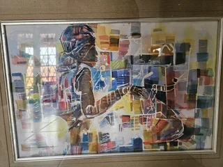 Beautiful African art print set in a heavy wooden frame in colored Silver