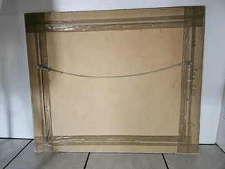 Beautiful African art print set in a heavy wooden frame in colored Silver