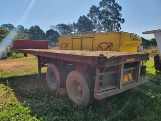 8m Henred Fruehauf DBL axel Flat Trailer