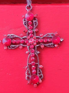 A jeweled cross pendant