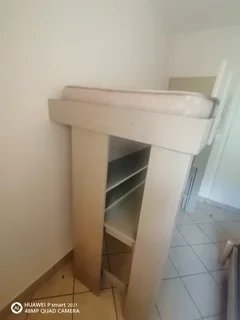 Bunk bed with table and shelves