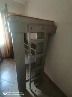 Bunk bed with table and shelves