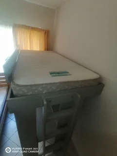 Bunk bed with table and shelves