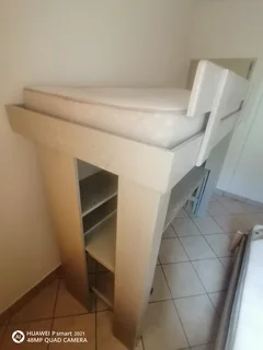 Bunk bed with table and shelves