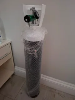 Oxygen cylinder with regulator used once in an emergency, no longer needed!