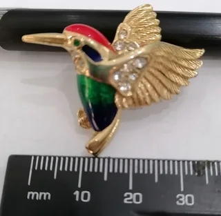 Swarovski crystal-embellished brooches