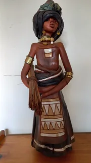 vintage handmade figurines (likely from the 1960 depict Zulu-inspired women in traditional roles