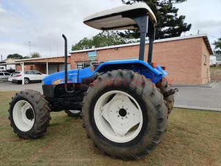 NEW HOLLAND TT75 (4X4) TRACTOR WITH LIFT ARMS AND ROOF