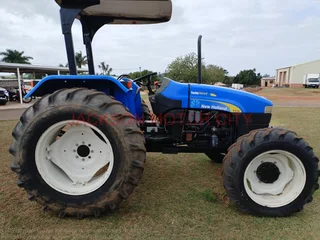 NEW HOLLAND TT75 (4X4) TRACTOR WITH LIFT ARMS AND ROOF