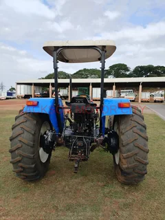 NEW HOLLAND TT75 (4X4) TRACTOR WITH LIFT ARMS AND ROOF