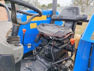 NEW HOLLAND TT75 (4X4) TRACTOR WITH LIFT ARMS AND ROOF