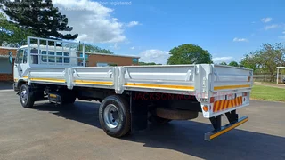 2010 - NISSAN DIESEL UD90 WITH DROPSIDE BODY
