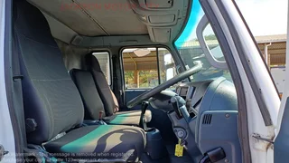 2010 - NISSAN DIESEL UD90 WITH DROPSIDE BODY