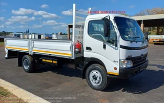 2011 - HINO 300_814 WITH DROPSIDE BODY AND TOWBAR