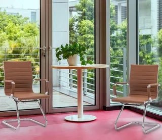 Office visitor chair with a chrome cantilever frame.