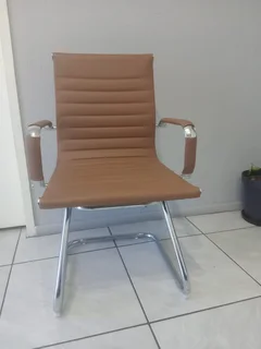 Office visitor chair with a chrome cantilever frame.