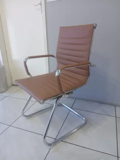Office visitor chair with a chrome cantilever frame.