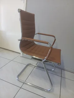 Office visitor chair with a chrome cantilever frame.