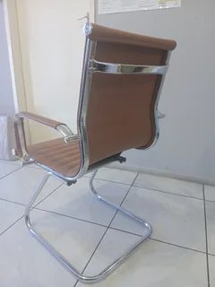 Office visitor chair with a chrome cantilever frame.