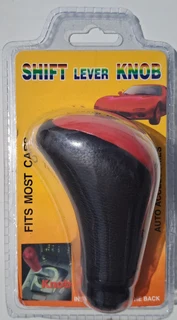 Shift Lever Knob. Fits most cars. Installation instructions are in the back side. I am in Orange Gro