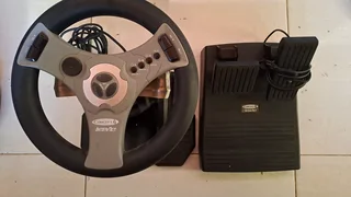 Racing Wheel with Foot Pedals InterAct Concept 4 for PlayStation 2. Complete. Used one.