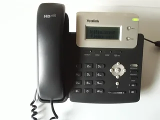 Yealink SIP-T20P VOIP IP Phone Black and Silver, LCD . In a box. As good as new. Working perfectly.