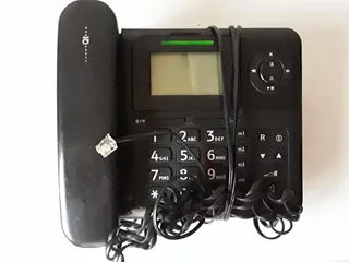 Qualitel Fixed Line Phone, Black and Silver, LCD screen . In a box. Whith Charger. As good as new .