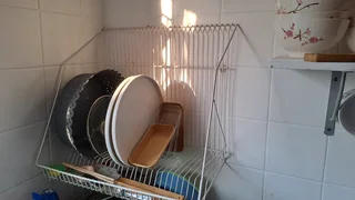 Dish  shelve for kitchen. Fits different size utensils. Very convenient.