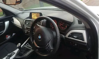 2015 BMW 118i (F20 LCI) Sport Line 5-door hatchback.Black cloth seatSpare wheelJackFactory fitted Ac