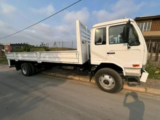 NISSAN UD90 8 TON DROPSIDE BIN