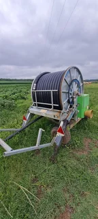 OCMIS AND BAUER TRAVELING IRRIGATORS