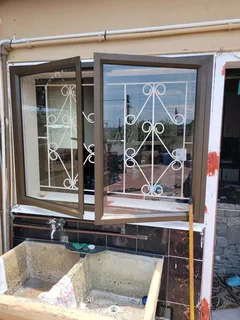 ALUMINUM WINDOWS DOORS SHOWERS BALUSTRADE