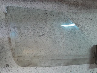 Fiat Uno spares for sale, Mia Left side window, reservoir for brakes and reservoir for water etc.