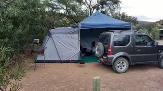 Oz trail gazebo with attached tent and double camp bed with mattress