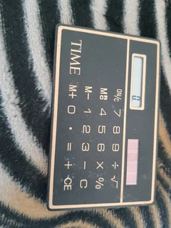 Slim line 1970s solar calculater